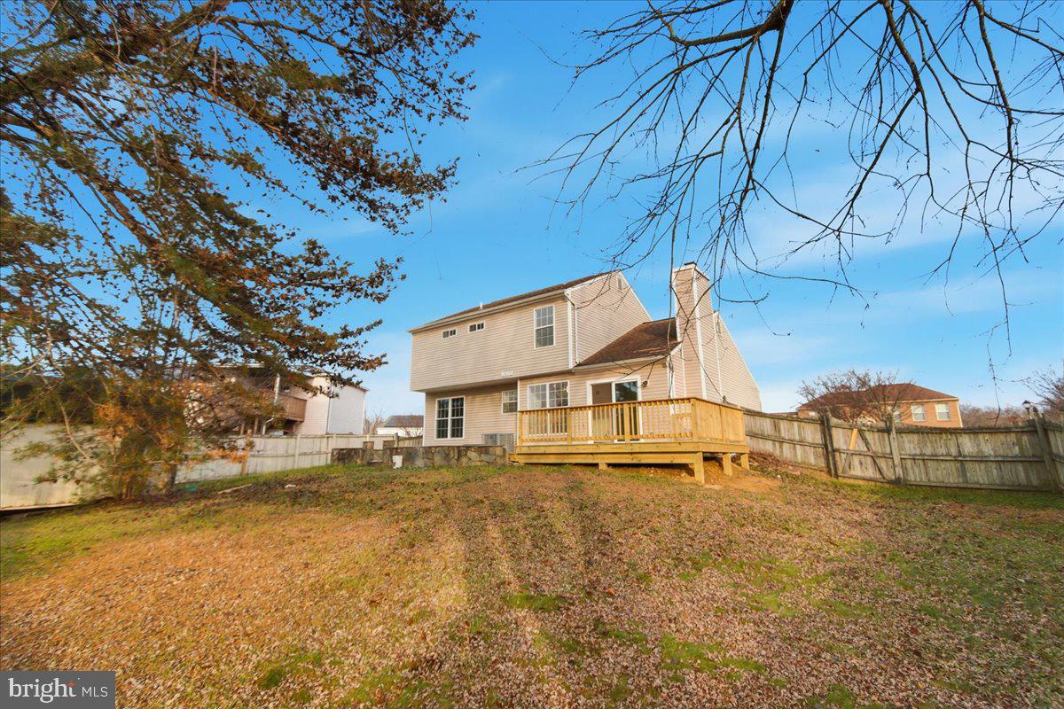 9409 Silver Fox Turn Clinton, MD 20735 - Photo 30 of 33 a view of residential houses with yard and wooden fence