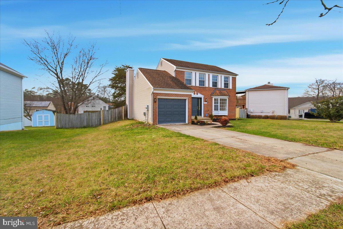 9409 Silver Fox Turn Clinton, MD 20735 - Photo 3 of 33 a front view of a house with a yard