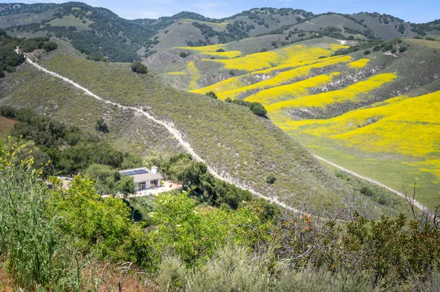 a view of an ocean and a mountain