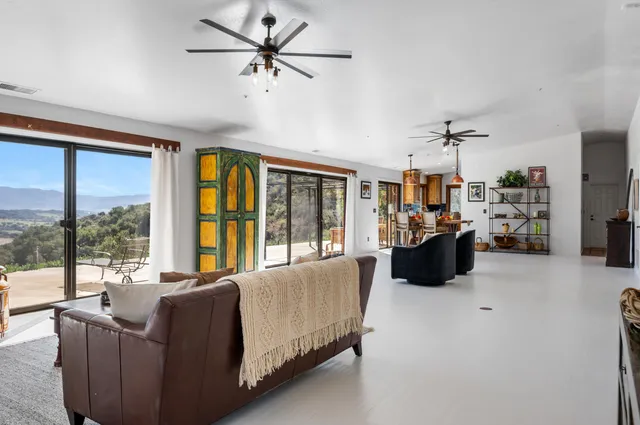 a dining room with furniture and window