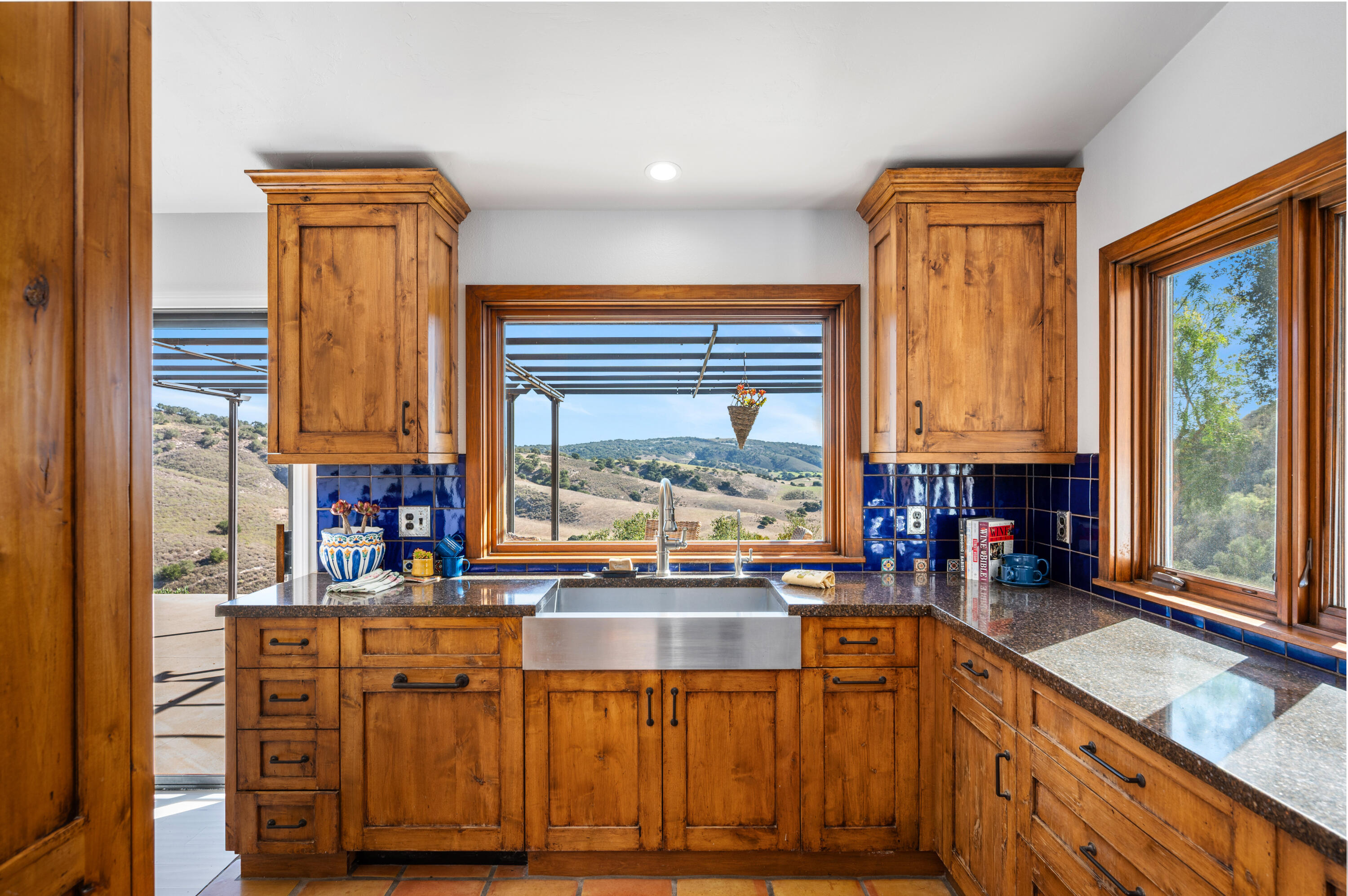 760 Falcon Ridge Lane Buellton, CA 93427 - Photo 13 of 51 a kitchen with stainless steel appliances wooden floor and a large window