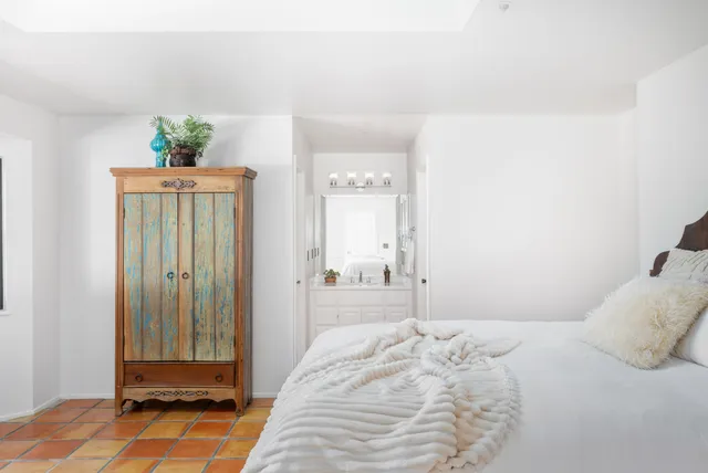 a bathroom with a sink mirror and a bathtub
