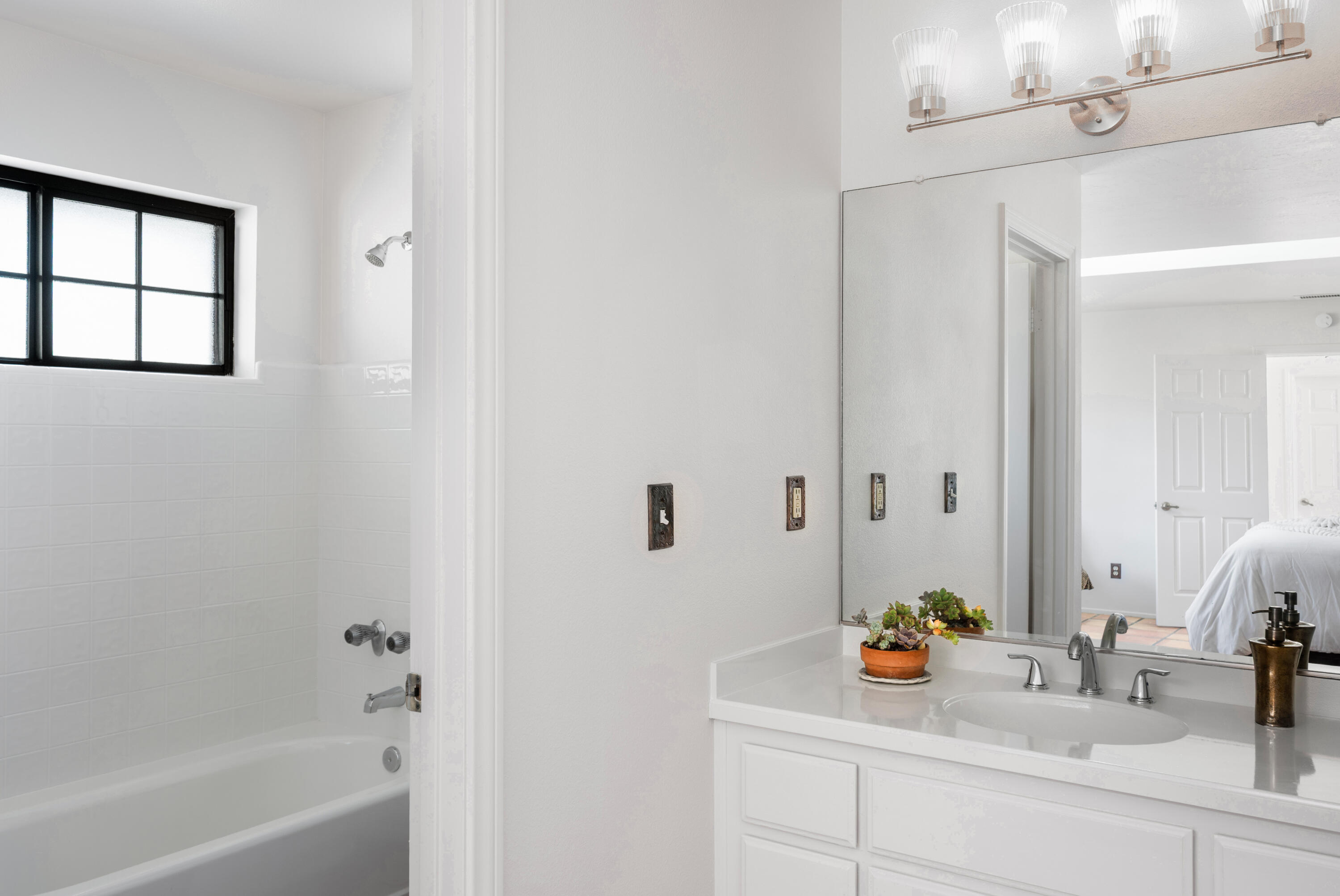 760 Falcon Ridge Lane Buellton, CA 93427 - Photo 23 of 51 a bathroom with a sink mirror and a bathtub