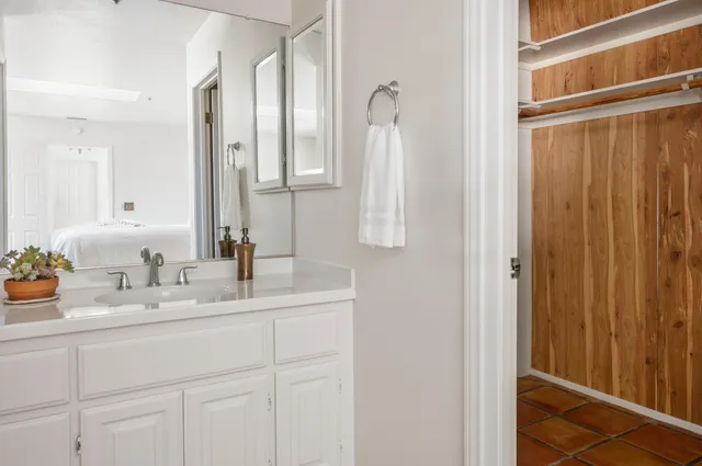 a bedroom with a bed and a couch