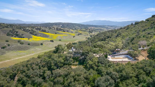 a view of a city with mountains in the background