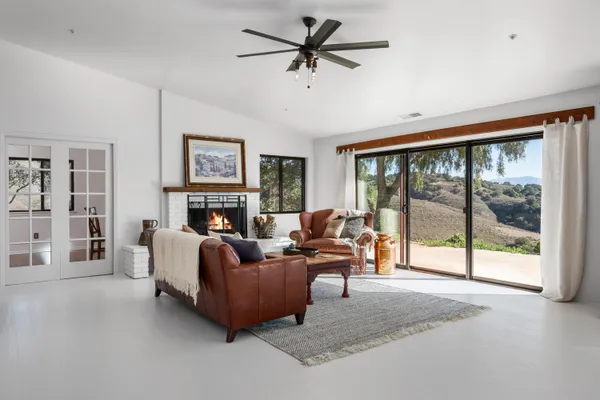 a living room with furniture and a window