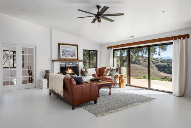 a living room with furniture and a window