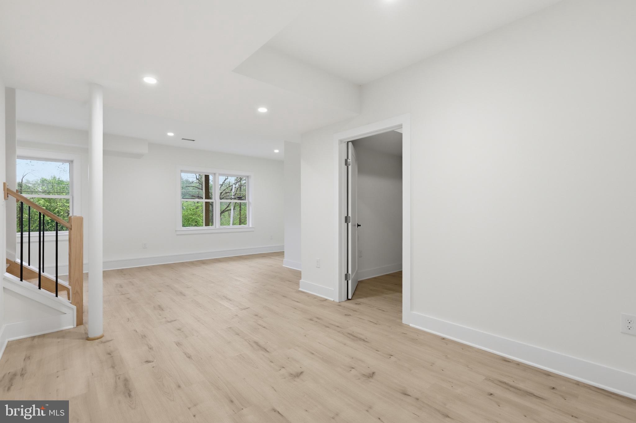 759 River Road Erwinna, PA 18920 - Photo 39 of 46 an empty room with wooden floor and windows