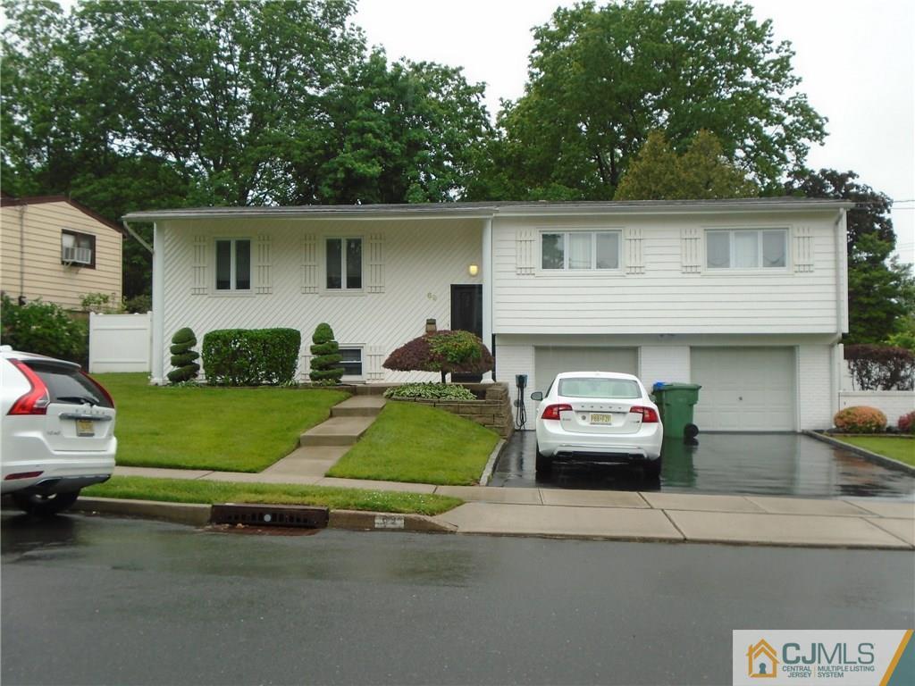 69 Harmon Road Edison, NJ 08837 - Photo 2 of 23 a front view of a house with a garage