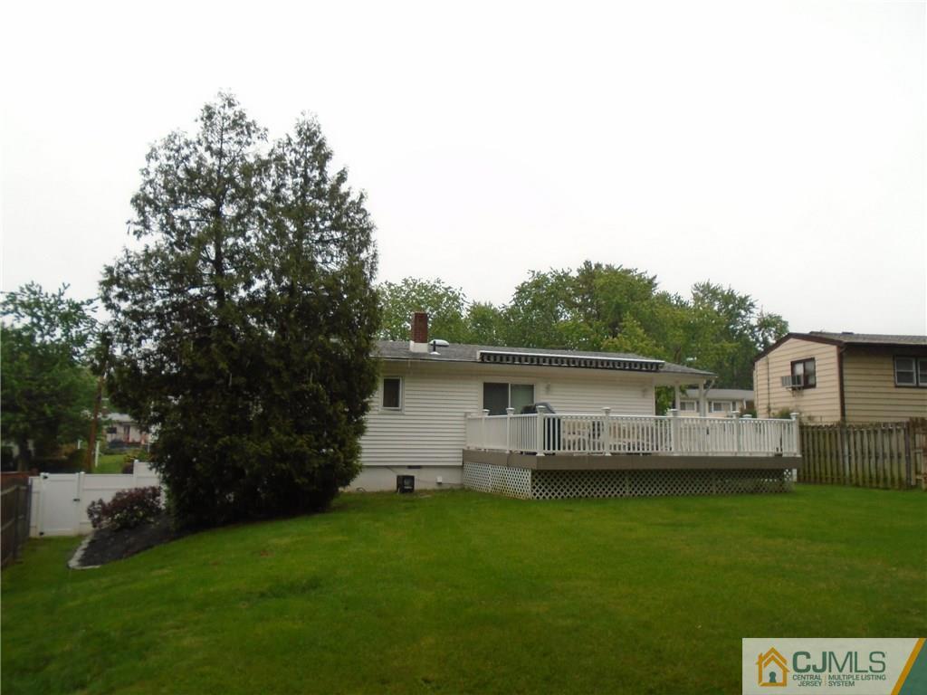 69 Harmon Road Edison, NJ 08837 - Photo 19 of 23 a view of a backyard with plants and large trees