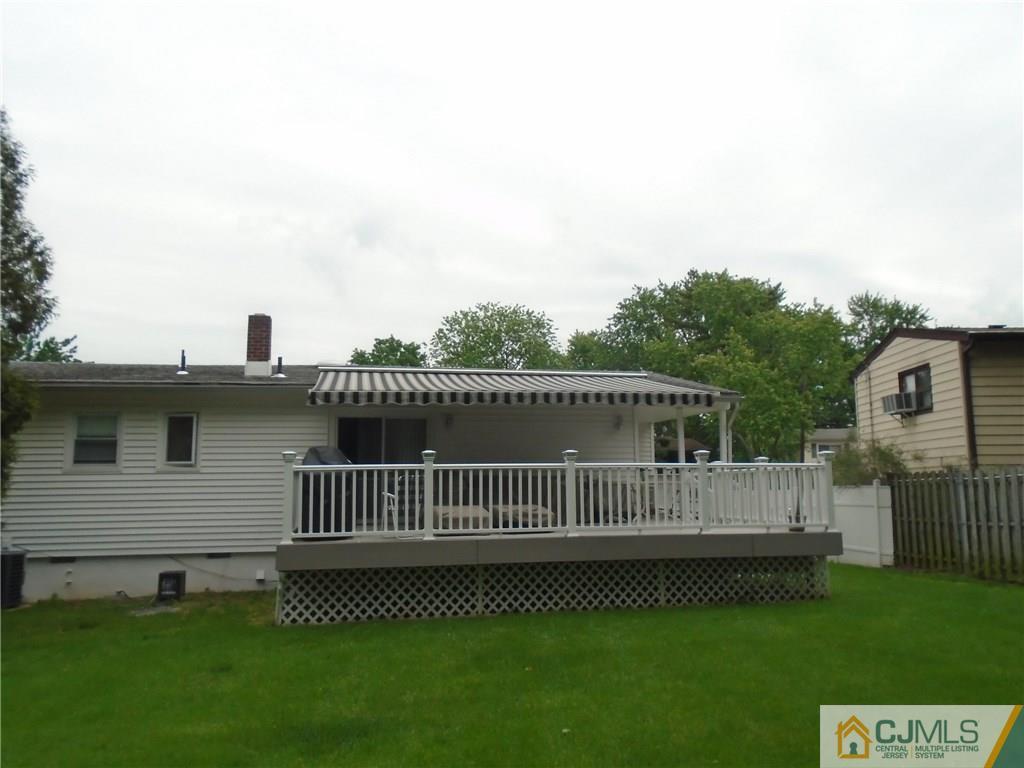69 Harmon Road Edison, NJ 08837 - Photo 20 of 23 a view of a house with a yard and deck