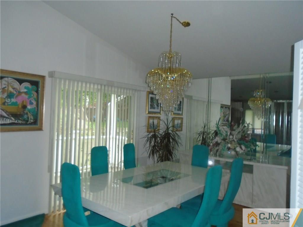 69 Harmon Road Edison, NJ 08837 - Photo 5 of 23 a view of a dining room with furniture window and wooden floor