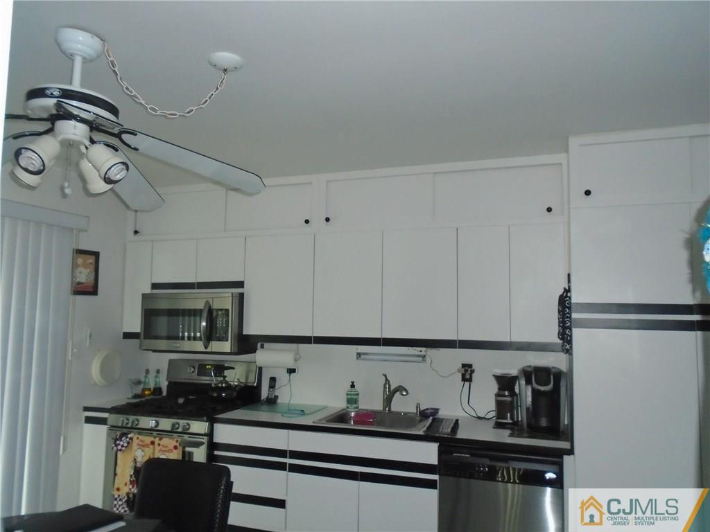 69 Harmon Road Edison, NJ 08837 - Photo 7 of 23 a kitchen with stainless steel appliances granite countertop a refrigerator sink and stove