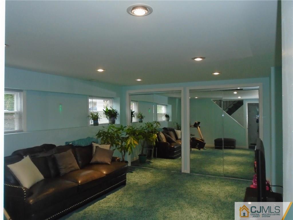 69 Harmon Road Edison, NJ 08837 - Photo 9 of 23 a living room with furniture and a yard