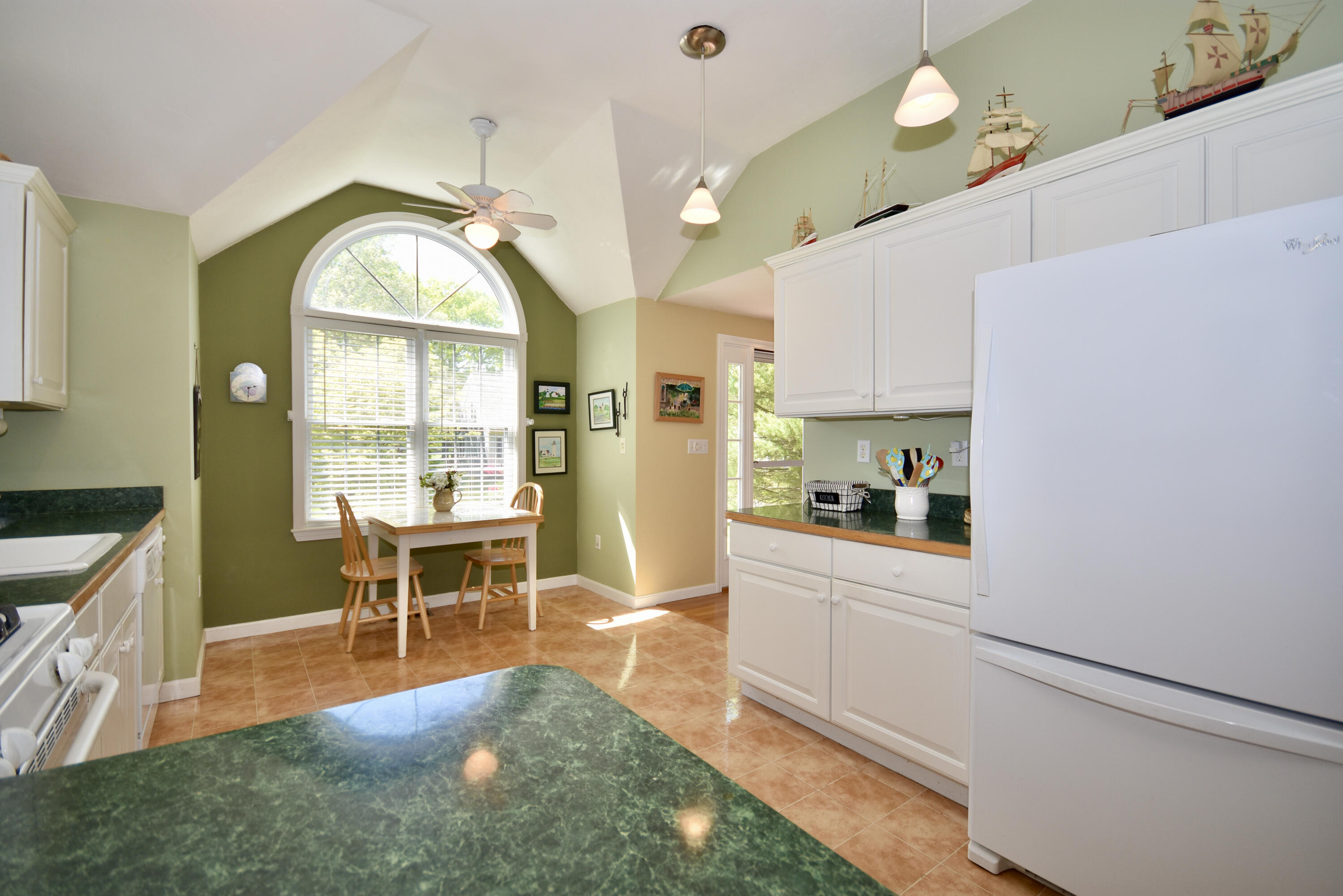 54 Snead Drive Mashpee, MA 02649 - Photo 11 of 32 a view of a kitchen and dining room