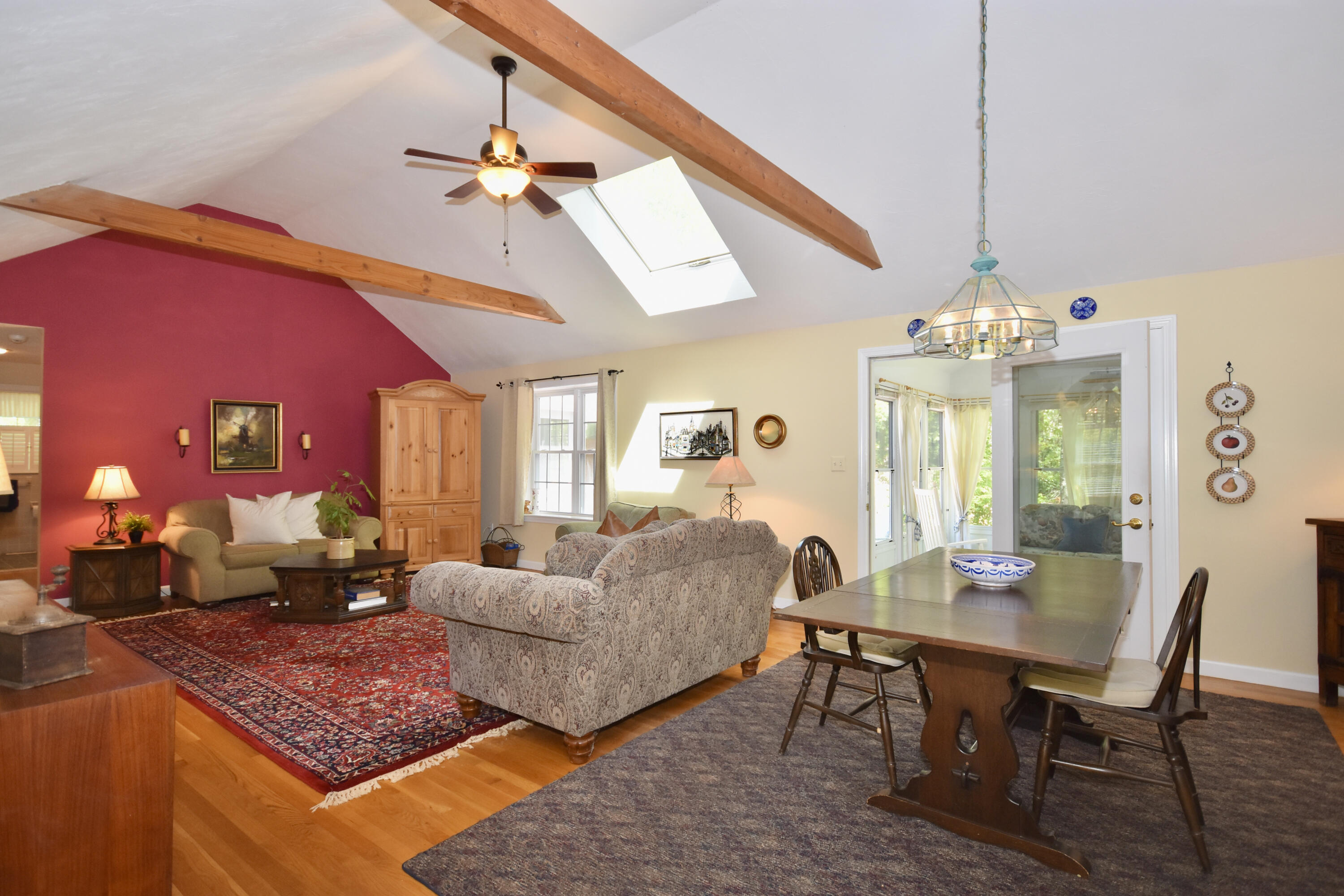 54 Snead Drive Mashpee, MA 02649 - Photo 13 of 32 a living room with furniture and a chandelier