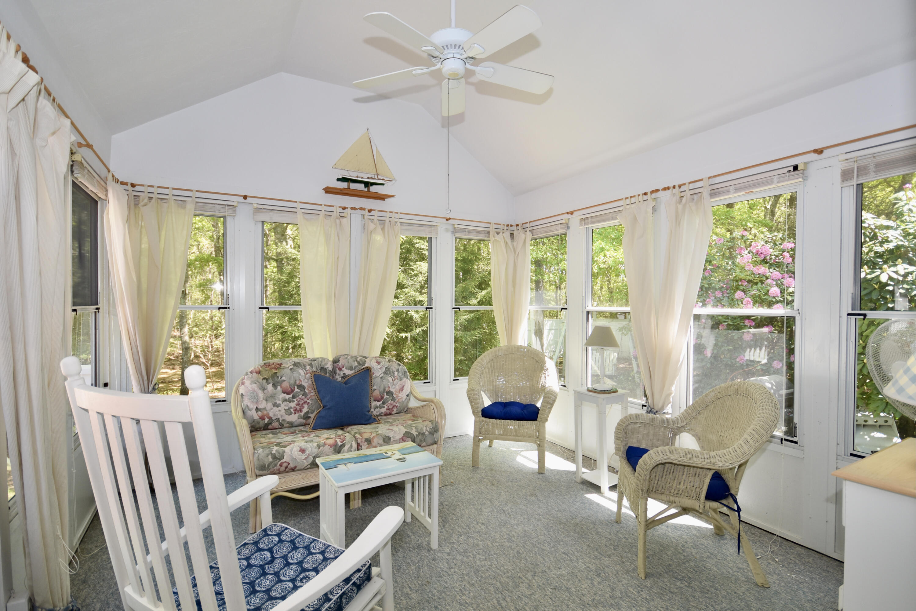 54 Snead Drive Mashpee, MA 02649 - Photo 17 of 32 a living room with furniture and large windows
