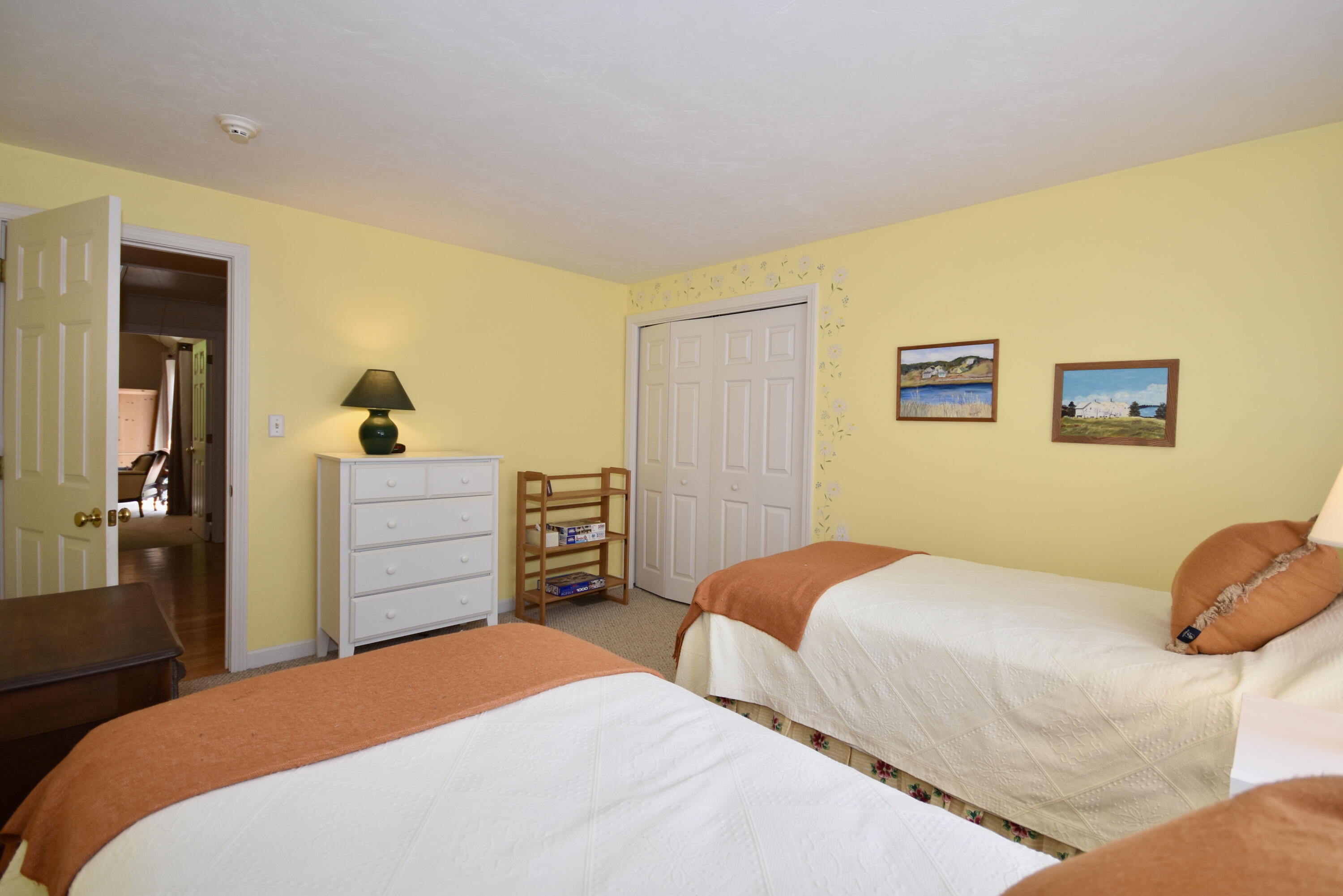 54 Snead Drive Mashpee, MA 02649 - Photo 24 of 32 a bedroom with a bed and a dresser