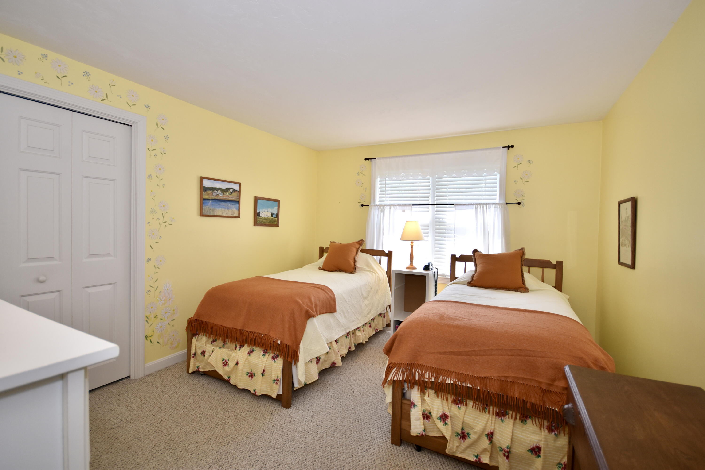 54 Snead Drive Mashpee, MA 02649 - Photo 25 of 32 a bedroom with two beds and painting on the wall