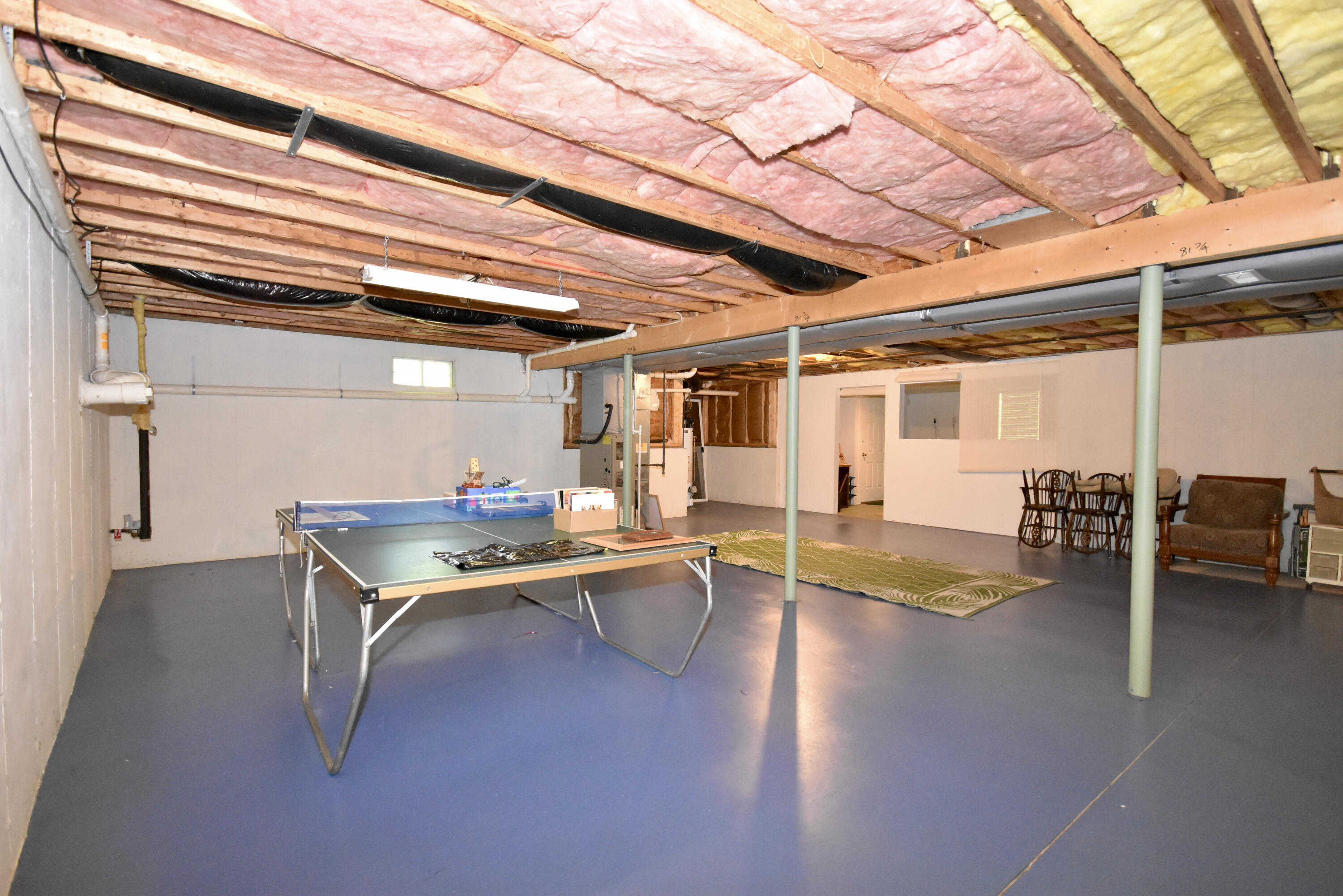 54 Snead Drive Mashpee, MA 02649 - Photo 27 of 32 a view of a patio with table and chairs with wooden floor and fence