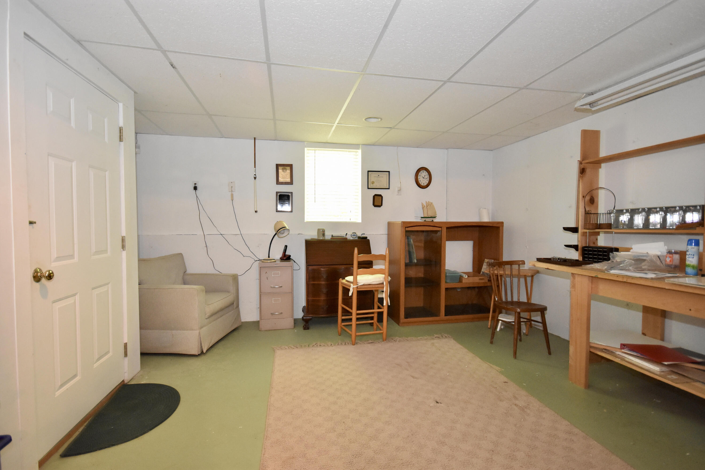 54 Snead Drive Mashpee, MA 02649 - Photo 29 of 32 a living room with furniture a flat screen tv and a large window