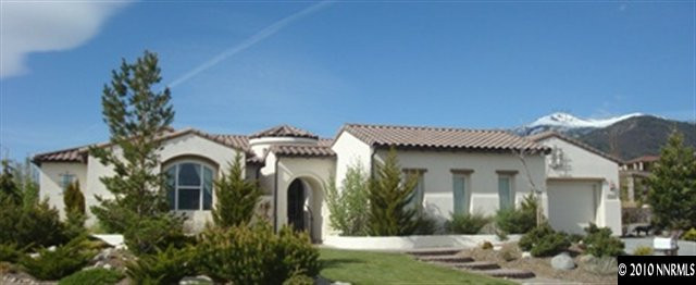 7005 Cour Street Reno, NV 89511 - Photo 1 of 9 a front view of a house with garden