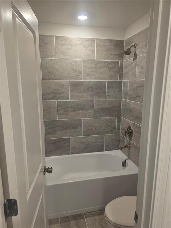 221 Brownlee Road Woodstock, GA 30188 - Photo 12 of 33 a bathroom with a bathtub and a shower