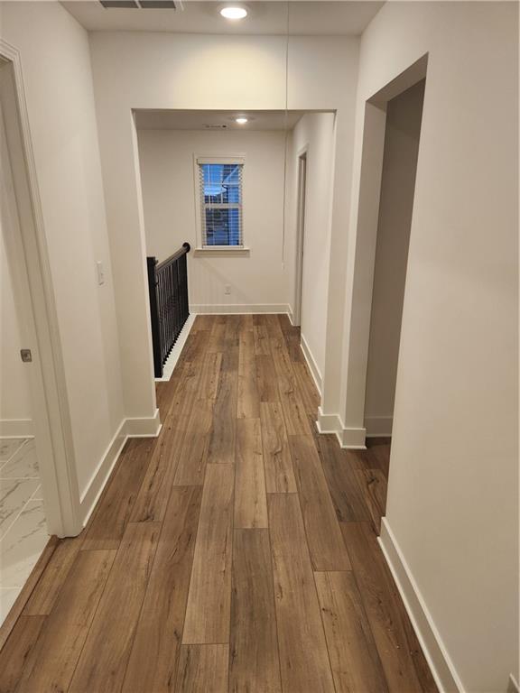 221 Brownlee Road Woodstock, GA 30188 - Photo 16 of 33 a view of a room with wooden floor and staircase