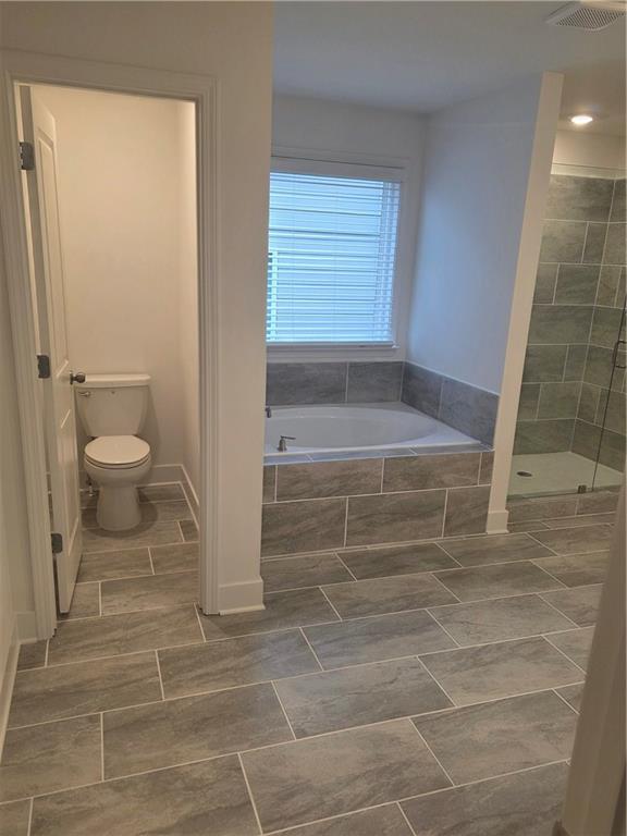 221 Brownlee Road Woodstock, GA 30188 - Photo 19 of 33 a bathroom with a toilet and a shower