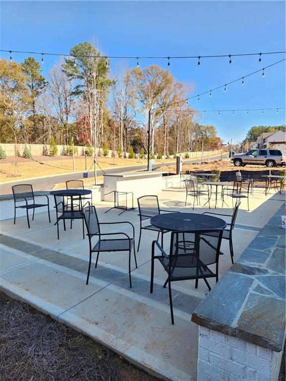 221 Brownlee Road Woodstock, GA 30188 - Photo 31 of 33 a view of a swimming pool with outdoor seating