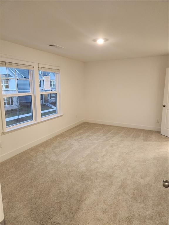 221 Brownlee Road Woodstock, GA 30188 - Photo 10 of 33 an empty room with windows