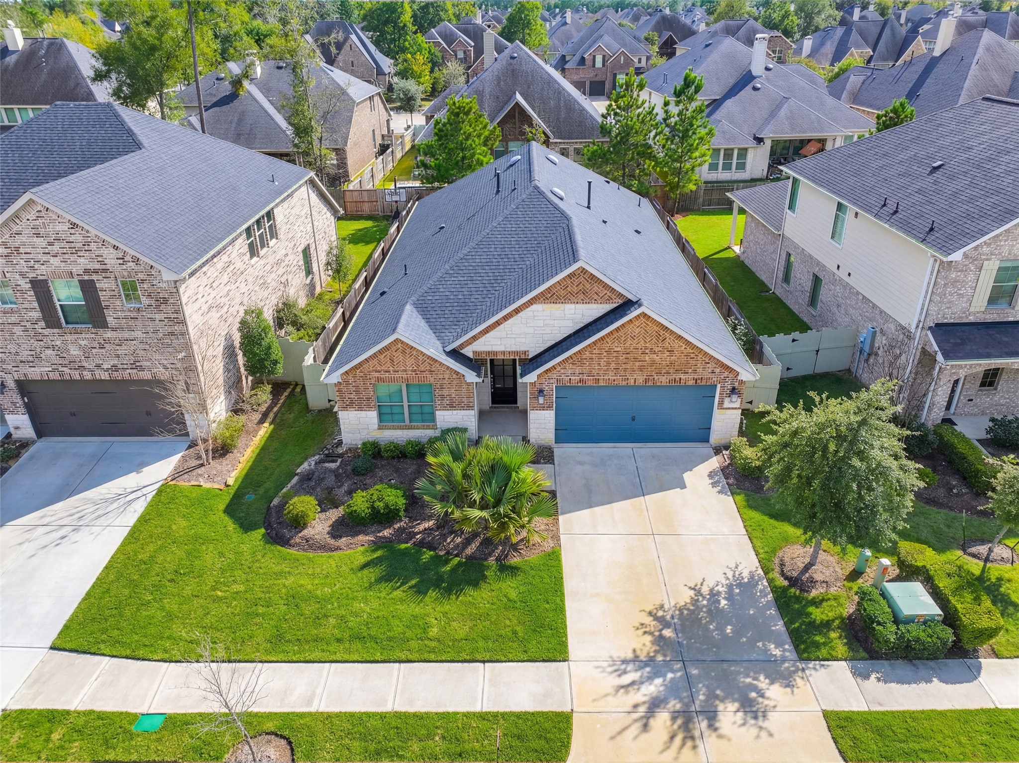 9840 Sweet Flag Court Conroe, TX 77385 - Photo 3 of 50 Former M/I Homes model showcasing trendy finishes, thoughtful design, and move-in ready condition—this one-story home offers style, comfort, and functionality throughout.