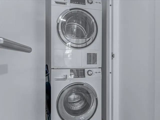 a bathroom with a toilet a sink and shower