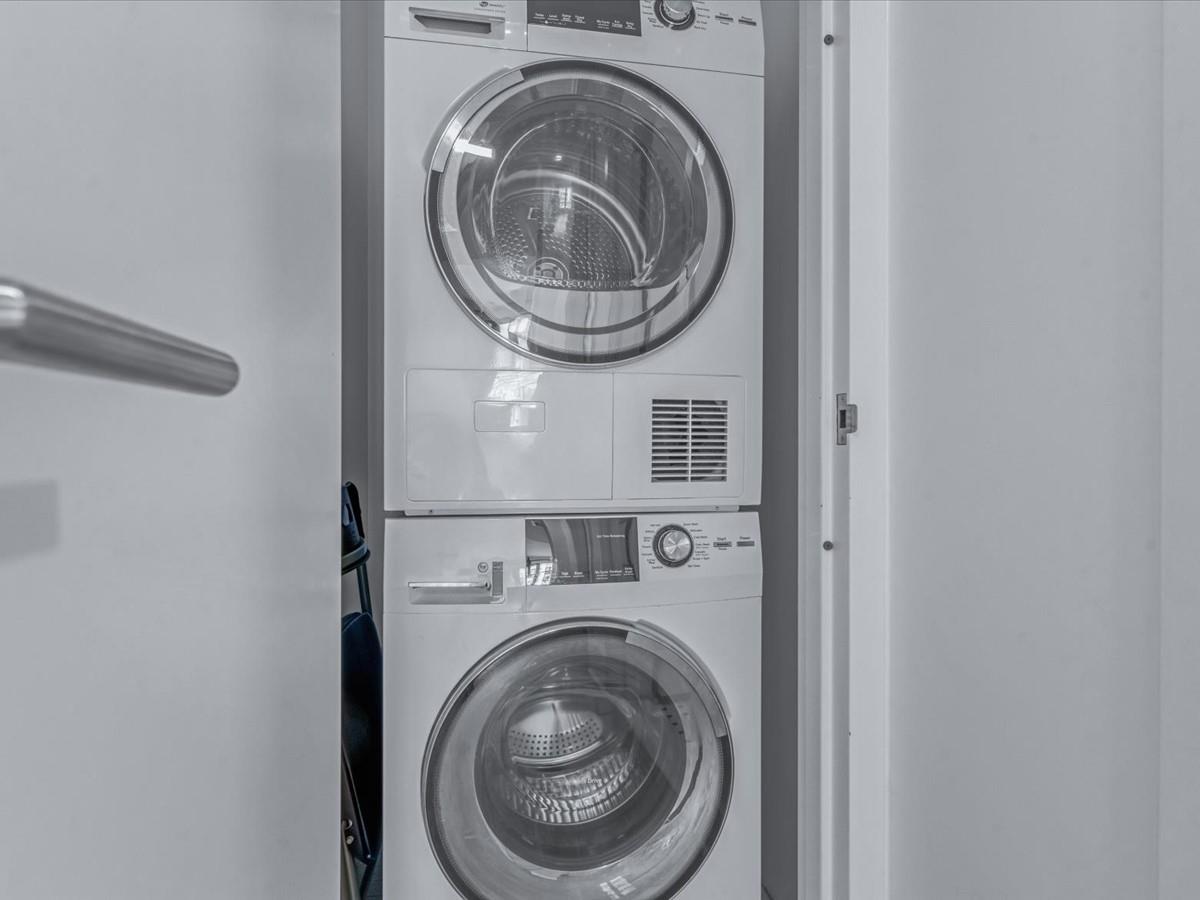 21-10 44th Drive, Unit 2B Queens, NY 11101 - Photo 12 of 19 a utility room with dryer and washer