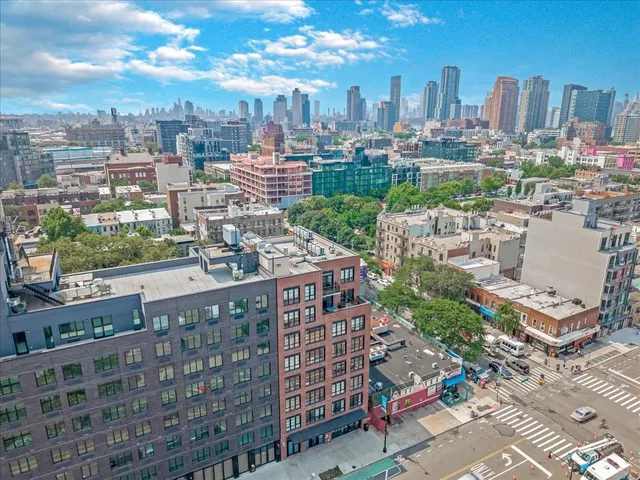 a view of a patio with table and chairs