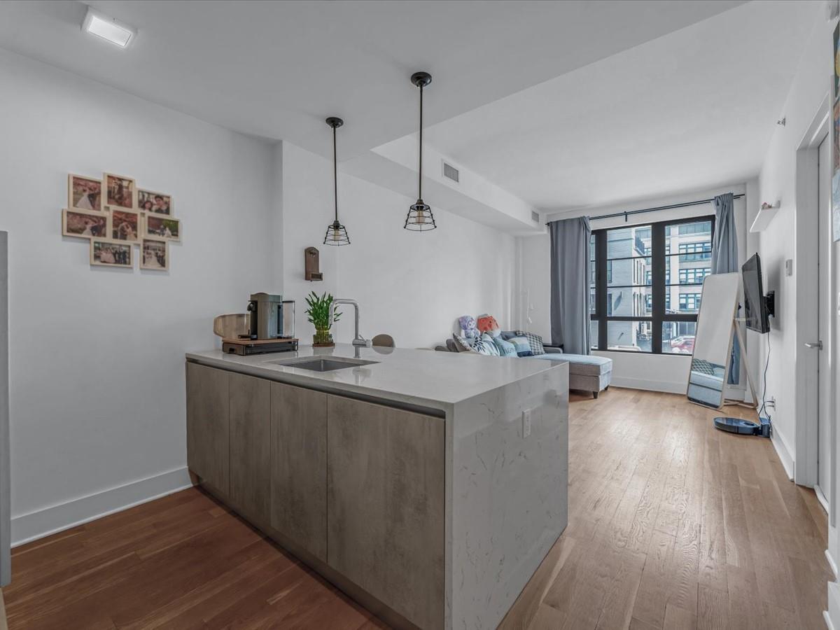 21-10 44th Drive, Unit 2B Queens, NY 11101 - Photo 19 of 19 a view of kitchen with sink and wooden floor