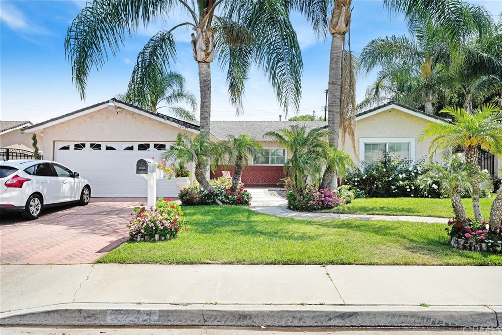 3243 Durham Drive Riverside, CA 92503 - Photo 1 of 23 a front view of a house with a garden