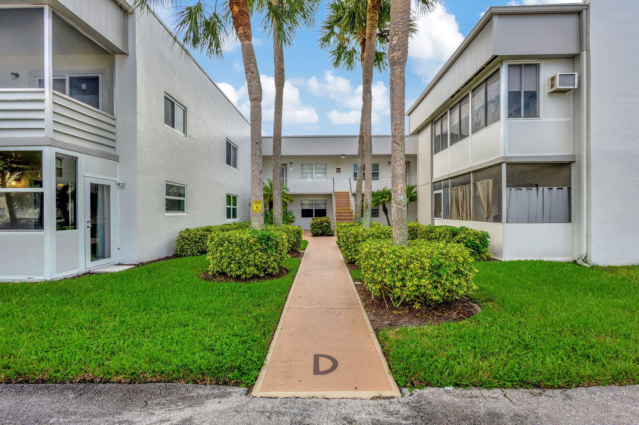 161 Normandy Lane, Unit D Delray Beach, FL 33484 - Photo 28 of 83 ENTRANCE TO BUIDLING- 161 ON LEFT