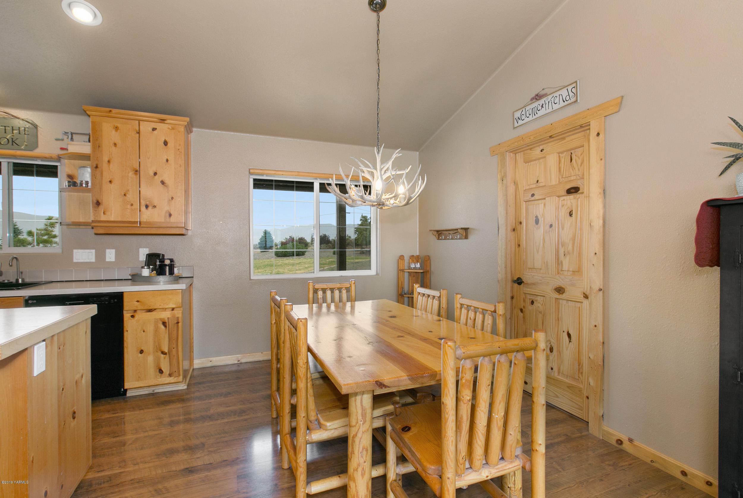 191 Mini Pines Road Yakima, WA 98903 - Photo 14 of 27 a view of a dining room with furniture window and wooden floor