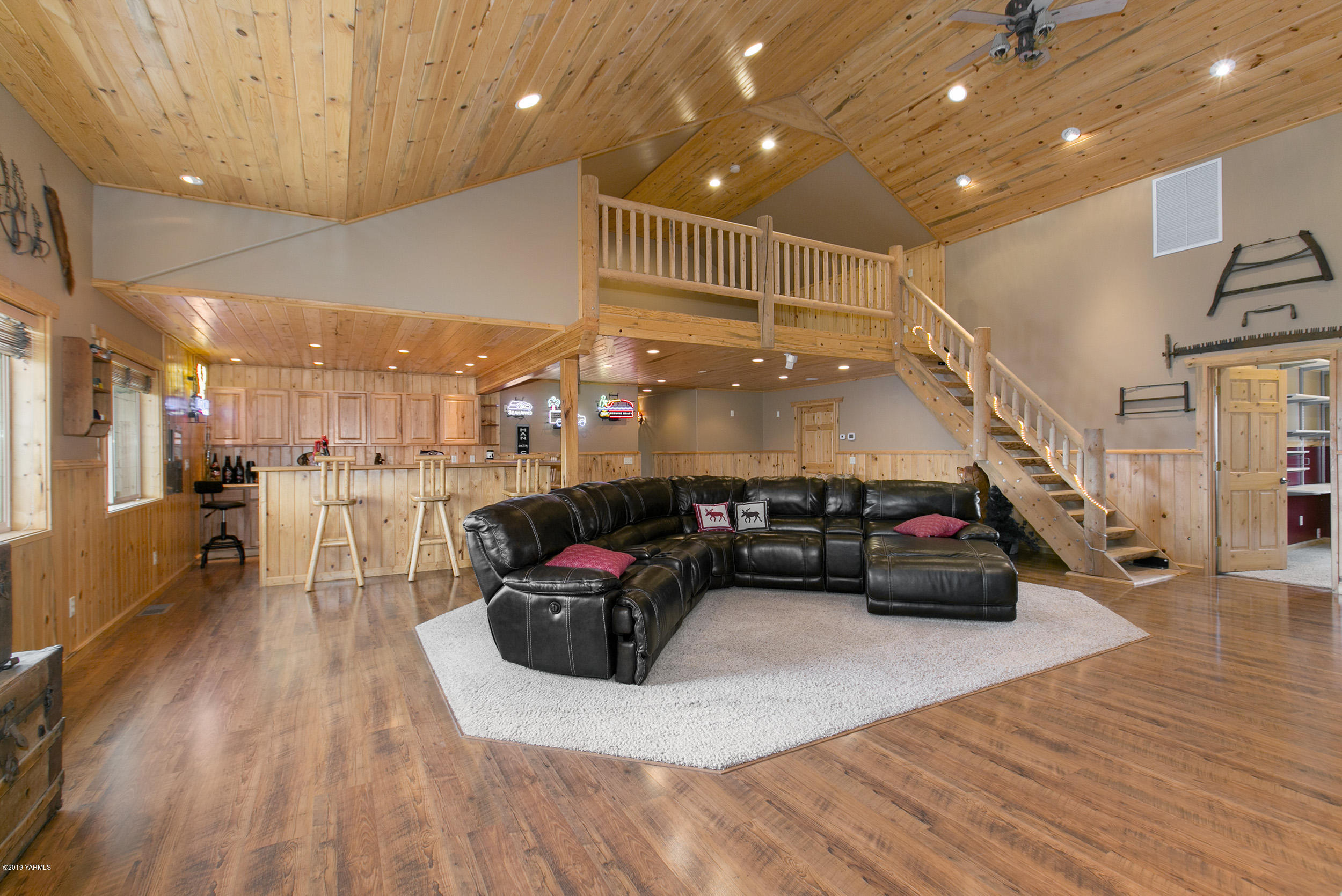191 Mini Pines Road Yakima, WA 98903 - Photo 4 of 27 a living room with lots of furniture and a chandelier
