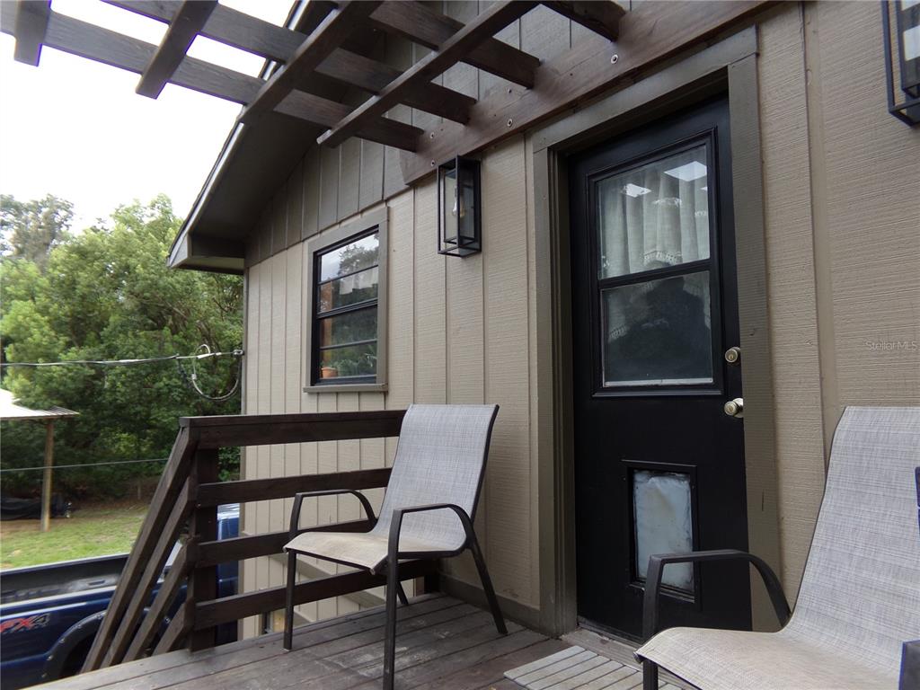 33068 Round Table Road Dade City, FL 33523 - Photo 38 of 82 a front view of a house with outdoor seating