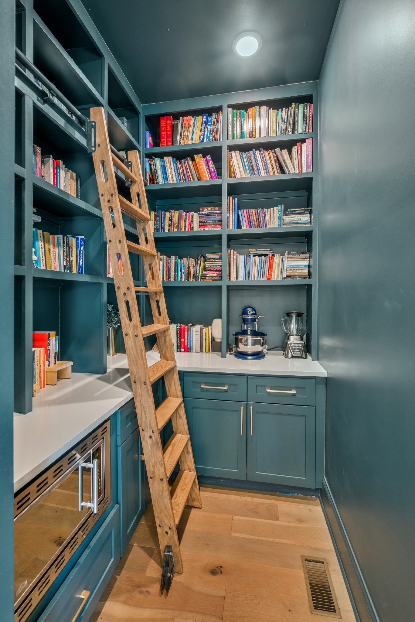 1007 Lischey Avenue Nashville, TN 37207 - Photo 2 of 52 a room with bookshelf and a wooden floor