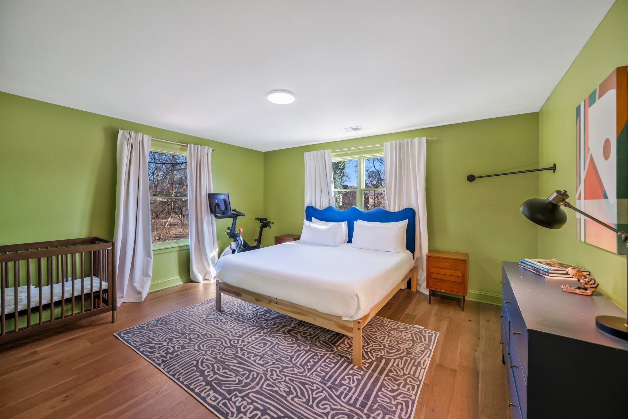 1007 Lischey Avenue Nashville, TN 37207 - Photo 31 of 52 a bedroom with a bed and wooden floor
