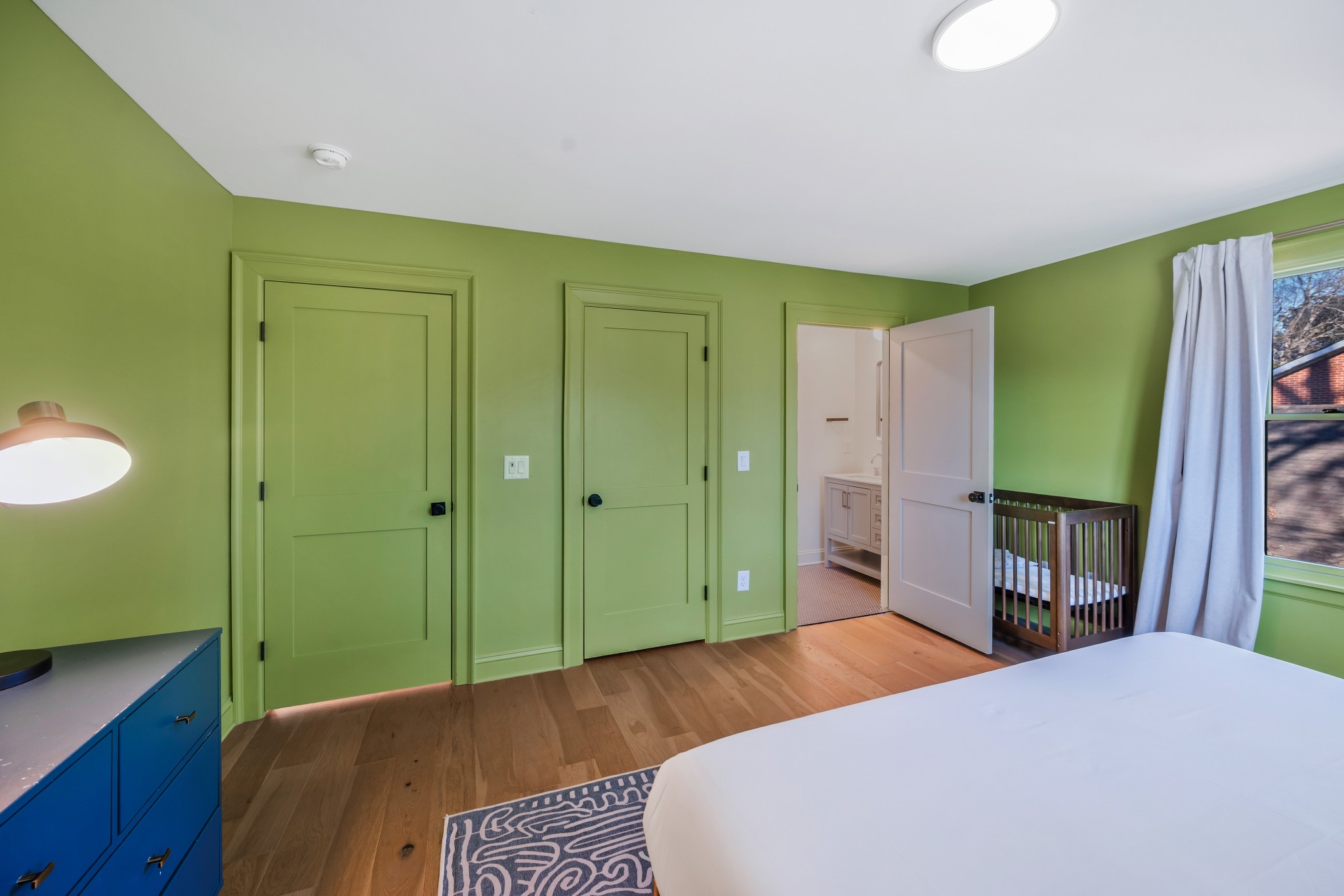 1007 Lischey Avenue Nashville, TN 37207 - Photo 32 of 52 a bedroom with a bed and a dresser
