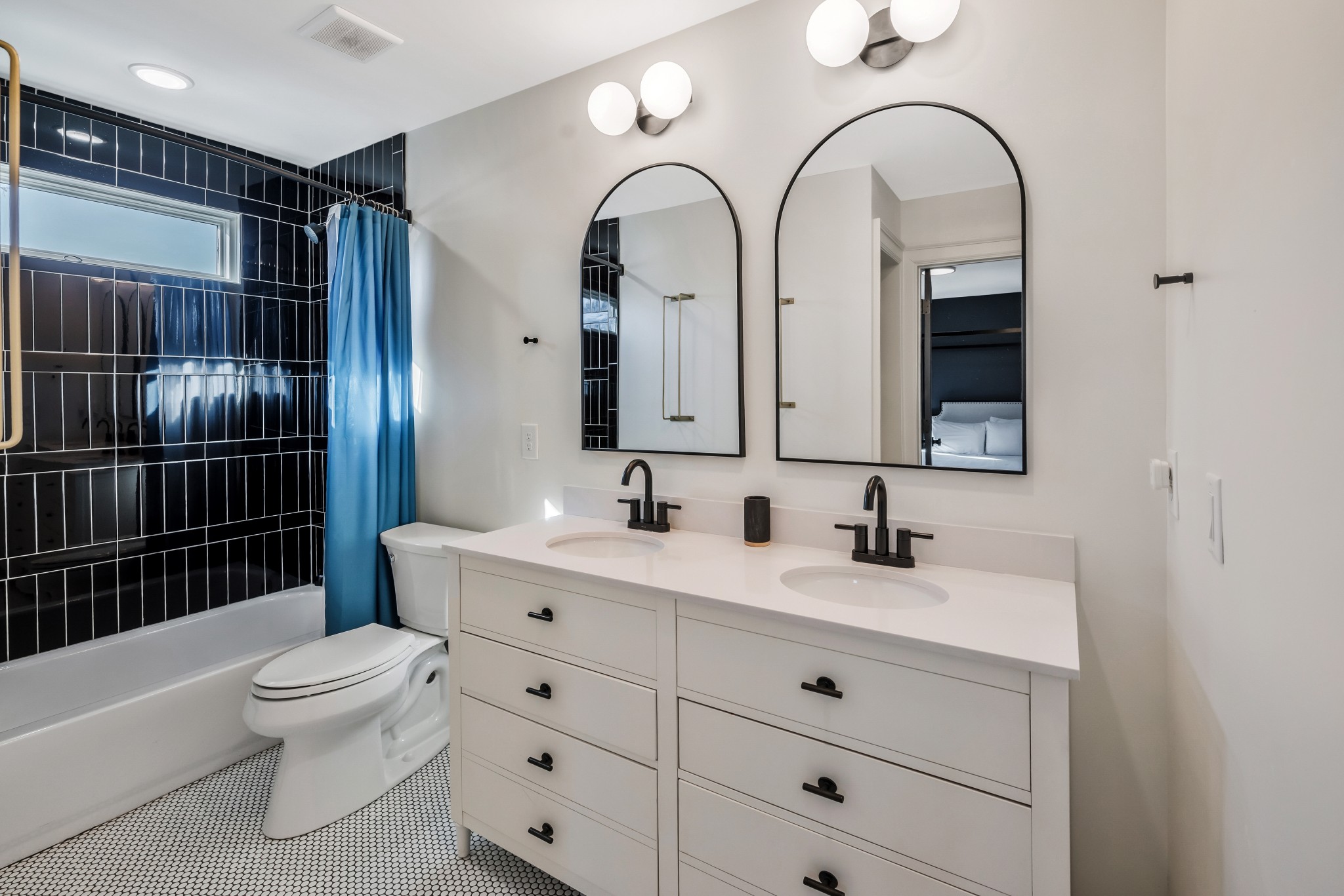 1007 Lischey Avenue Nashville, TN 37207 - Photo 38 of 52 a bathroom with a double vanity sink toilet and shower