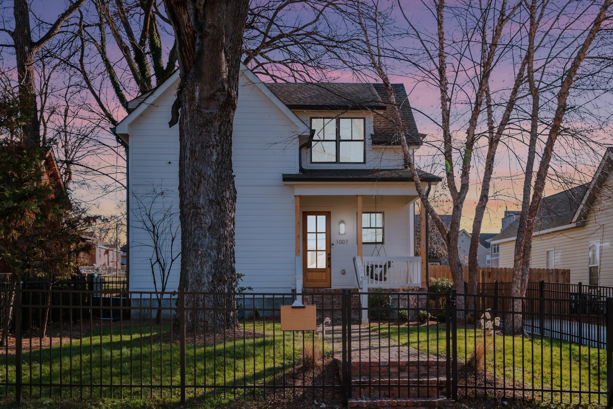 1007 Lischey Avenue Nashville, TN 37207 - Photo 52 of 52 a front view of a house with a garden