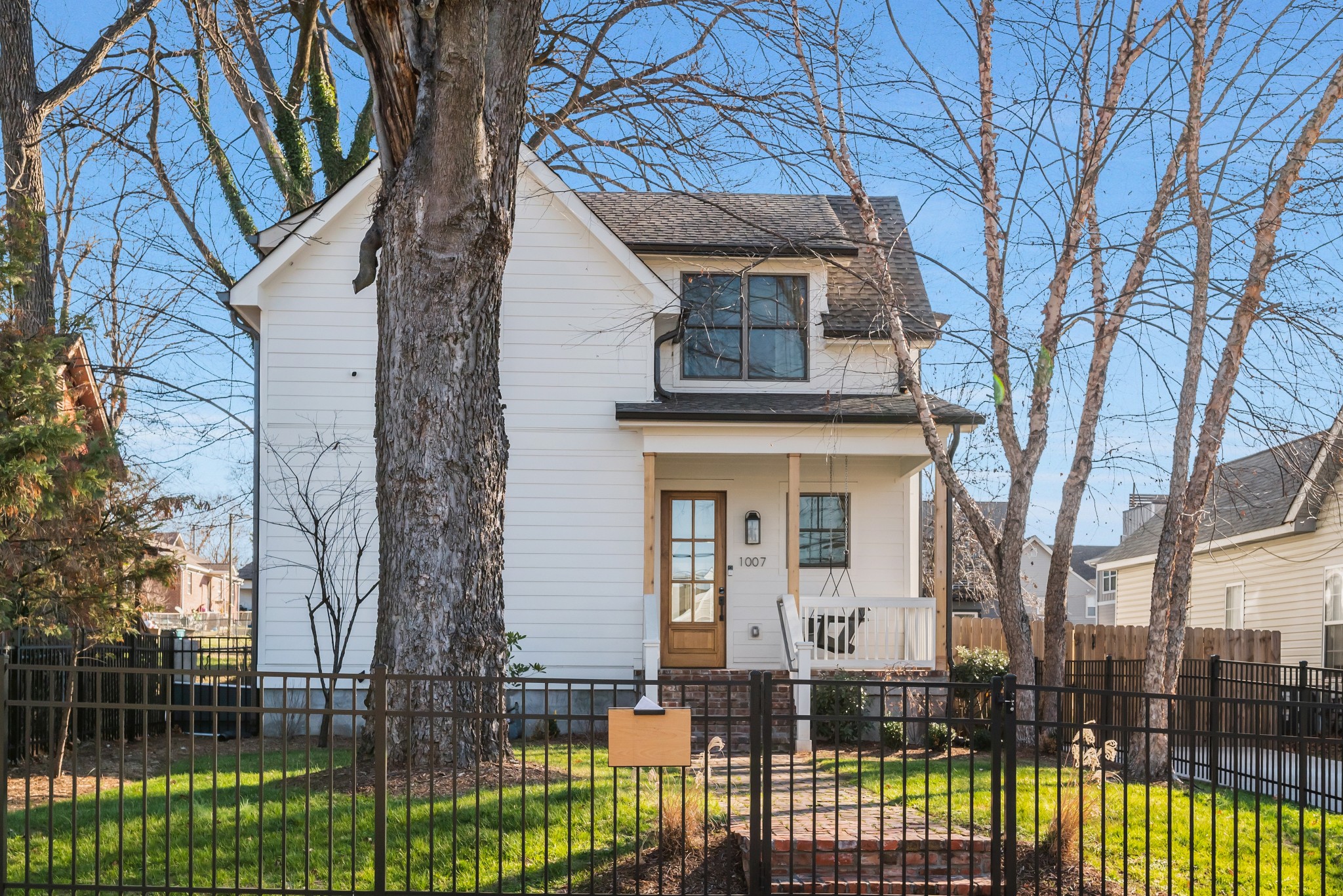1007 Lischey Avenue Nashville, TN 37207 - Photo 6 of 52 a front view of a house with a iron gate