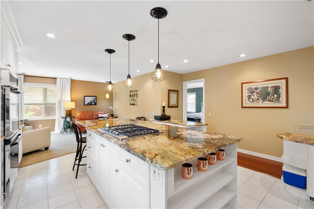 1580 Williamsburg Road Pittsburgh, PA 15243 - Photo 11 of 41 a kitchen that has a stove a table and chairs in it