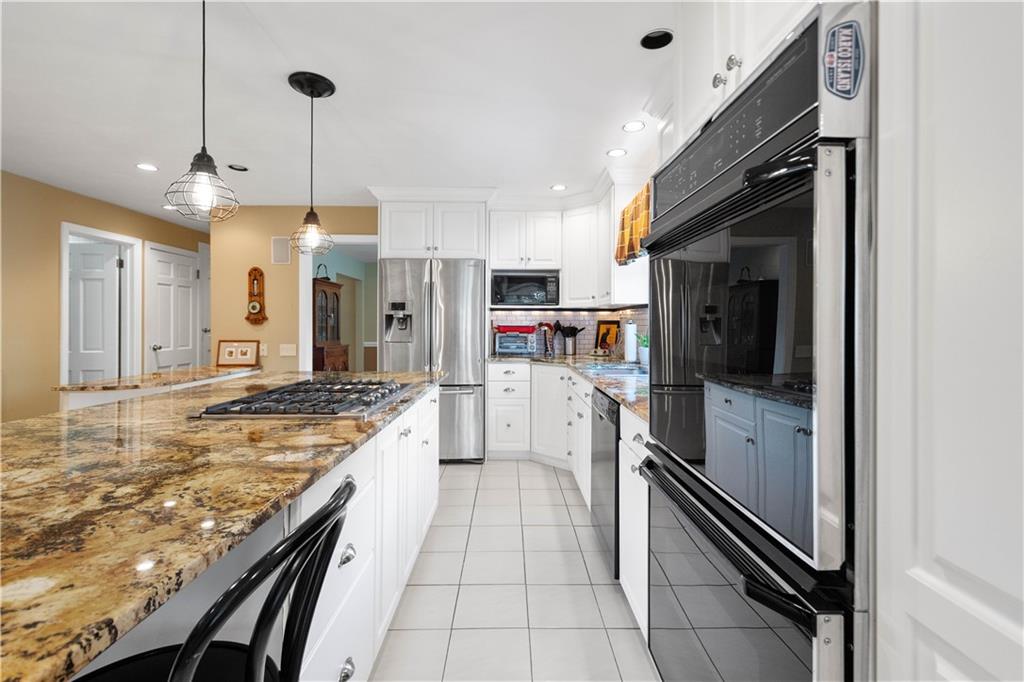 1580 Williamsburg Road Pittsburgh, PA 15243 - Photo 12 of 41 a kitchen with stainless steel appliances granite countertop a refrigerator and a sink