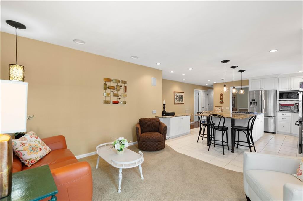 1580 Williamsburg Road Pittsburgh, PA 15243 - Photo 14 of 41 a living room with furniture and a dining table with rug floor